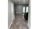 Inviting living room with hardwood floors, neutral walls, and sliding glass doors to the outside at 9471 Comeau St, Gotha, FL 34734