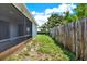 Lush backyard featuring a well-maintained lawn and a privacy fence for outdoor enjoyment at 963 Beach Breeze Dr, Orlando, FL 32835