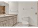 Bathroom featuring a toilet, marble-look vanity, and a tiled shower area at 963 Beach Breeze Dr, Orlando, FL 32835