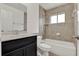 Bathroom featuring bathtub, vanity, and shower, with stylish tiled wall at 963 Beach Breeze Dr, Orlando, FL 32835