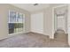 Bright bedroom with carpet, closet and large window, creating an inviting space at 963 Beach Breeze Dr, Orlando, FL 32835