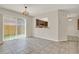 Open dining area with a view to the backyard and kitchen pass-through at 963 Beach Breeze Dr, Orlando, FL 32835