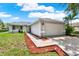 Charming single-story home featuring a well-manicured lawn and a two-car garage with ample parking at 963 Beach Breeze Dr, Orlando, FL 32835
