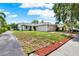 Charming single-story home with a two-car garage and well-maintained front yard at 963 Beach Breeze Dr, Orlando, FL 32835