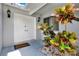 Inviting double front door with modern lighting and decorative plants at 963 Beach Breeze Dr, Orlando, FL 32835