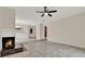 Open-concept living room with a fireplace, tile floors, and access to other rooms at 963 Beach Breeze Dr, Orlando, FL 32835