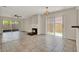 Spacious living room featuring a cozy fireplace and sliding glass doors at 963 Beach Breeze Dr, Orlando, FL 32835