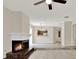 Comfortable living room featuring fireplace, tile flooring and an open layout at 963 Beach Breeze Dr, Orlando, FL 32835