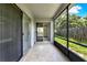 Inviting screened porch with tile flooring, sliding glass doors, and relaxing outdoor space at 963 Beach Breeze Dr, Orlando, FL 32835
