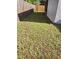 Narrow side yard featuring a wooden fence, sparse grass, and potential for landscaping at 963 Beach Breeze Dr, Orlando, FL 32835