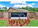 A Cinnamon Bay sign situated within a brick wall and surrounded by well-maintained landscaping at 963 Beach Breeze Dr, Orlando, FL 32835