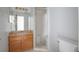 Bathroom with a stand up shower, wood vanity, and a white toilet at 9948 Timber Oaks Ct # 14, Orlando, FL 32817