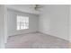Neutral bedroom featuring a ceiling fan and a window with blinds at 9948 Timber Oaks Ct # 14, Orlando, FL 32817
