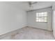 Bedroom featuring neutral carpet, a ceiling fan, and a bright window at 9948 Timber Oaks Ct # 14, Orlando, FL 32817