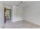 Bedroom featuring neutral carpet, a closet, and an open doorway at 9948 Timber Oaks Ct # 14, Orlando, FL 32817