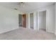 Neutral bedroom featuring a ceiling fan and multiple closets at 9948 Timber Oaks Ct # 14, Orlando, FL 32817