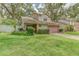 Beautiful home with a two-car garage, tidy landscaping, and a well-kept lawn enhancing curb appeal at 9948 Timber Oaks Ct # 14, Orlando, FL 32817