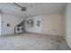 Spacious garage featuring a laundry area, water heater, and room for storage at 9948 Timber Oaks Ct # 14, Orlando, FL 32817