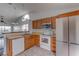 Traditional kitchen featuring oak cabinets, stainless steel appliances, and a bright, airy layout at 9948 Timber Oaks Ct # 14, Orlando, FL 32817