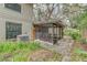 Rear exterior view of a home showing a screened in patio and brick pavers at 9948 Timber Oaks Ct # 14, Orlando, FL 32817