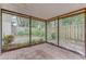 Covered patio with tile flooring, screened walls, and a view of the private backyard area at 9948 Timber Oaks Ct # 14, Orlando, FL 32817
