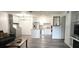 Bright open-plan living room and kitchen with stainless steel appliances at 320 Forestway Cir # 107, Altamonte Springs, FL 32701