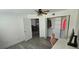 Home office with a ceiling fan, large windows, and plenty of storage at 320 Forestway Cir # 107, Altamonte Springs, FL 32701