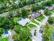 Aerial shot displaying the property with a pool, outlined in red, nestled in a neighborhood setting at 107 Laurel Oak Dr, Longwood, FL 32779