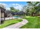 Large backyard with pool, screened enclosure, spacious patio and easy access to the house at 107 Laurel Oak Dr, Longwood, FL 32779