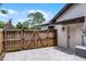 Fenced backyard with double gate, small patio and easy access to side entrance at 107 Laurel Oak Dr, Longwood, FL 32779