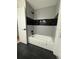 Modern bathroom featuring gray and black patterned tile and stylish fixtures at 107 Laurel Oak Dr, Longwood, FL 32779