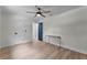 Bedroom with wood floors, simple desk, and two entryways allowing for flexible layout and design at 107 Laurel Oak Dr, Longwood, FL 32779