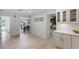Bright, open floorplan with a view to dining area and kitchen featuring white cabinets at 107 Laurel Oak Dr, Longwood, FL 32779