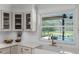 Kitchen features stainless steel appliances, white countertops, and a view of the pool at 107 Laurel Oak Dr, Longwood, FL 32779