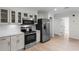 Well-lit kitchen featuring stainless steel appliances, subway tile backsplash, and white cabinetry at 107 Laurel Oak Dr, Longwood, FL 32779