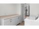 Convenient laundry room with ample cabinet space and a butcher block folding area at 107 Laurel Oak Dr, Longwood, FL 32779