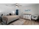 Well-appointed main bedroom with white trim, wood floors and neutral color palette at 107 Laurel Oak Dr, Longwood, FL 32779