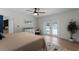 Beautiful main bedroom with white trim, view to pool, and neutral color palette at 107 Laurel Oak Dr, Longwood, FL 32779