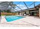 Sparkling pool inside a large screened enclosure, with an expansive patio for entertaining at 107 Laurel Oak Dr, Longwood, FL 32779
