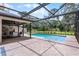 Lovely pool with screened-in lanai, and patio area surrounded by mature trees and landscaping at 107 Laurel Oak Dr, Longwood, FL 32779
