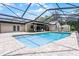 Refreshing pool inside a screened enclosure, complemented by a spacious patio and lush landscaping at 107 Laurel Oak Dr, Longwood, FL 32779