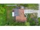 This overhead house shot highlights roof, yard and long driveway at 111 Main St, Windermere, FL 34786