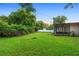 The spacious backyard offers plenty of room to relax and entertain with a screened patio at 111 Main St, Windermere, FL 34786