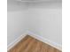 Unfinished basement features wood floors and white painted walls at 111 Main St, Windermere, FL 34786