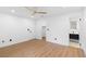 Bedroom features wood floors, ceiling fan and an ensuite bathroom at 111 Main St, Windermere, FL 34786