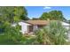 Charming single-story home with a stone accent exterior and a well-manicured lawn at 111 Main St, Windermere, FL 34786