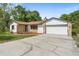 Charming single-story home with a stone accent exterior and a well-manicured lawn at 111 Main St, Windermere, FL 34786