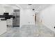 Kitchen featuring tiled flooring, stainless appliances and white cabinetry at 111 Main St, Windermere, FL 34786