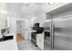 Bright kitchen with modern appliances, skylight, and sleek cabinetry at 111 Main St, Windermere, FL 34786