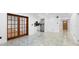 Living room featuring tiled flooring, recessed lighting and wood door at 111 Main St, Windermere, FL 34786